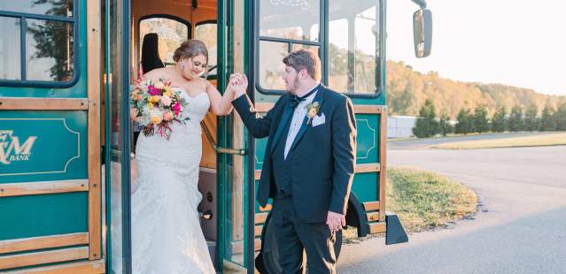 Wedding Couple getting off of Trolley