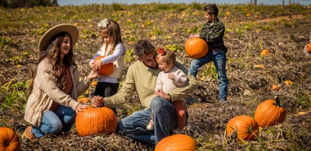 Family at Patterson Farm with Pumpkins
