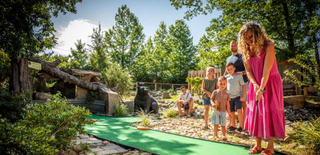 Family playing putt putt at Tiger World