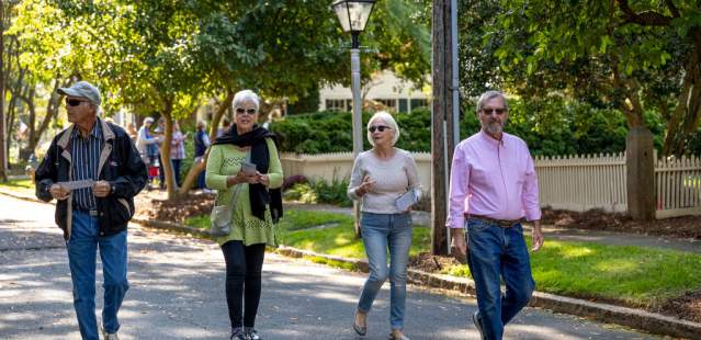 Group of people walking down street