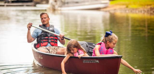 Little girls and dad in canoe