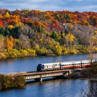 Amtrack Train crossing Huron River in Fall