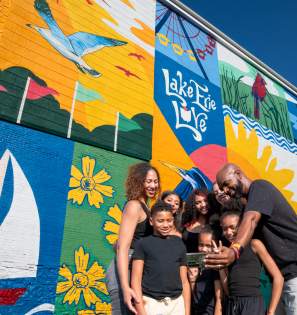S&IO East Mural family selfie