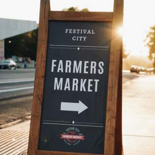 festival city farmers market sign