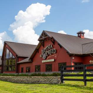 Exterior photo of Jeptha Creed Distillery, which is located in Shelby County, Kentucky, and is on the Kentucky Bourbon Trail Craft Tour®.