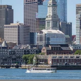 Charles Riverboat cruise in front of Custom House Tower