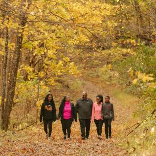 Family of five hiking in the fall.
