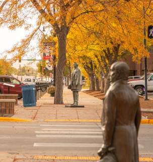 Fall colors with the city of president statues in downtown rapid city, sd