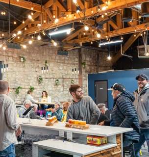 people drinking beer at the bar of local brewery woodland republic in rapid city, sd