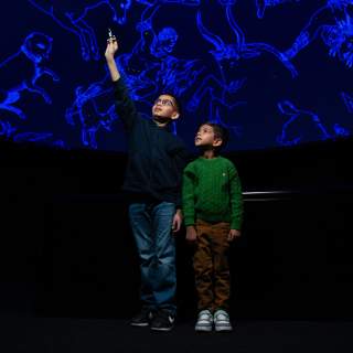 Children enjoying the planetarium at Science Central in Fort Wayne, Indiana.