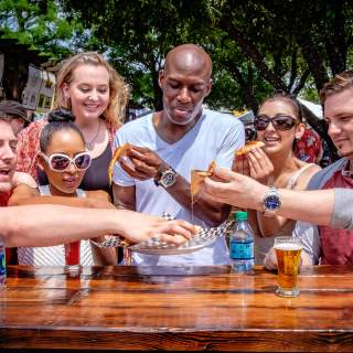 People enjoying food and drinks at Main Street Fest in Grapevine, Texas