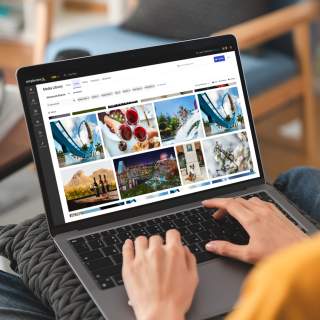 Simpleview DAM powered by Cloudinary - Mockup on Laptop with woman
