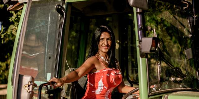America of Oastbrook Vineyard sat in her tractor smiling