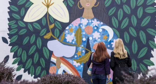 012 Women Looking at What Blooms is Us Mural Along North Avenue in Wauwatosa