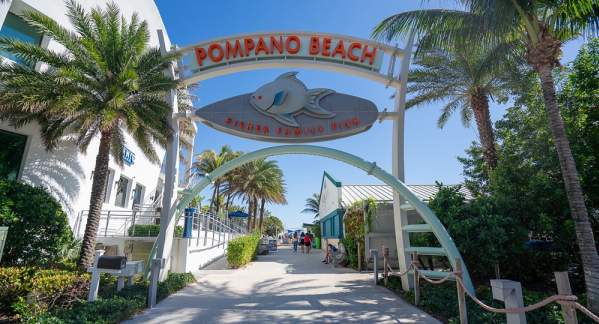 An archway at the entrance to the Pompano Beach Fisher Family Pier.