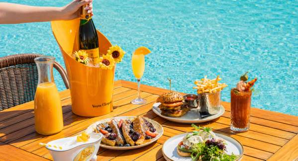 Poolside Brunch at Lola's by the Water in Pompano Beach, complete with a bottle of champagne.
