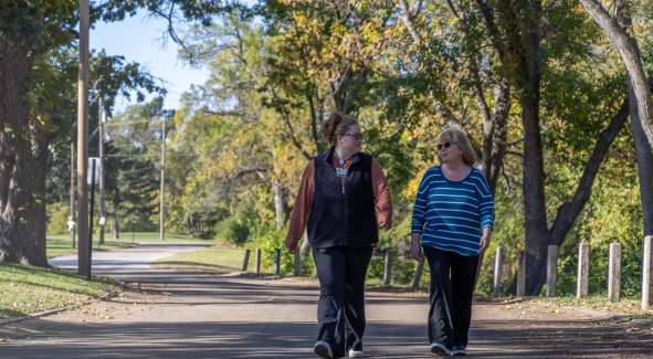 Two women walking in a park in Salina, Kansas