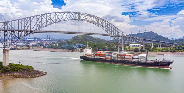 Container ship sailing near Bridge Las Americas , Panama Canal, Panama City