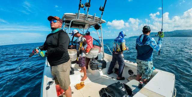 A crew of people fishing in the depths of the sea.