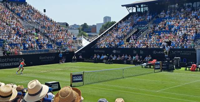 A tennis match played at Rothesay International tennis with busy crowds in the stands