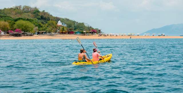 Couple kayaking off the coast of Taboga Island in Panama Province.