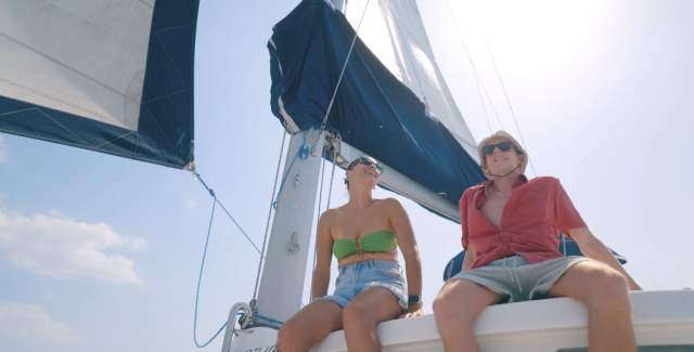 Couple enjoying a sailing trip in the Pacific waters of West Panama Province.