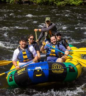 A group whitewater rafting with Adirondack Adventure Center