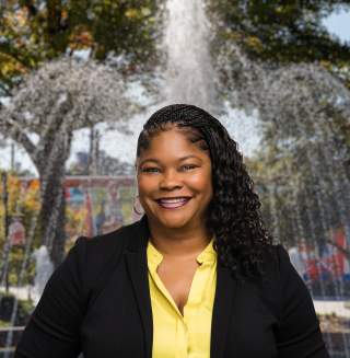 Amanda Cusaac Headshot with city background