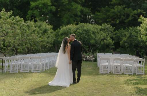 Bride and groom in an orchard