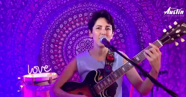 Gina Chavez sings and plays guitar During Visit Austins Best Seat in the House Live Music Edition virtual performance