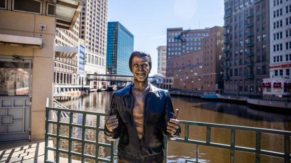 a bronze statue of the Happy Days character The Fonz on the Milwaukee RiverWalk