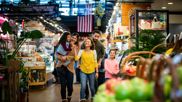a family walking through the Milwaukee Public Market