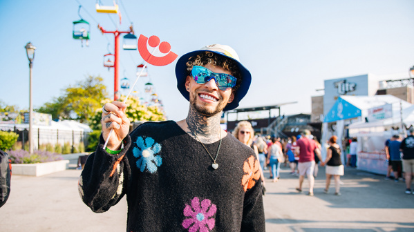 man smiling in a flower setting