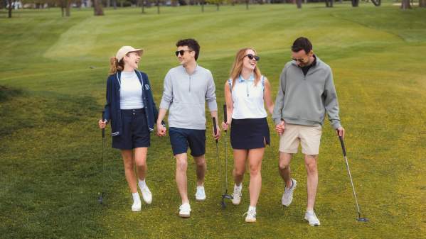 Golfers smiling on green