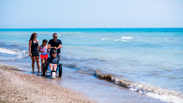 family of 4, son in wheelchair on Bradford Beach