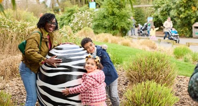 Family around large Easter egg at Chester Zoo
