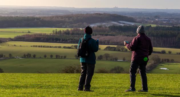 Two women overlooking a view of the Wolds