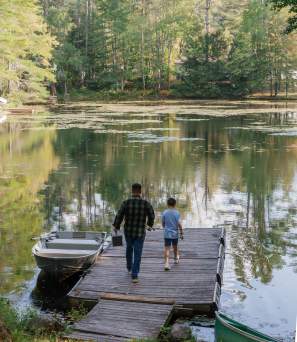 Father and son fishing at Hide-A-Way Waterfront Cottages