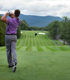 Man Teeing Off at the Golf Course