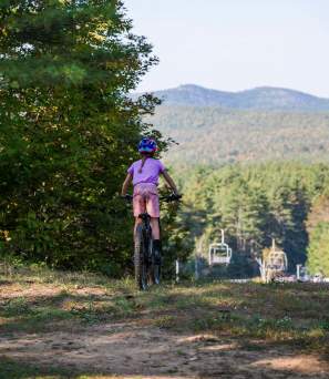 Kid mountain biking on Gore Mountain