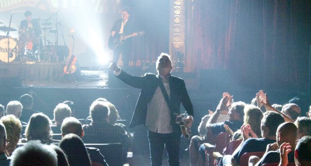 Man performing and walking up an aisle at Mauch Chunk Opera House