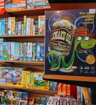 Section of kids & family games at The Game Preserve