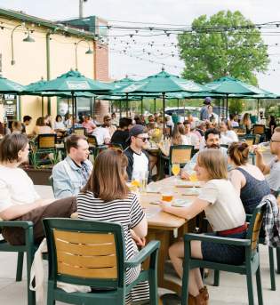 A large group dining on Upland's patio