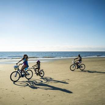 The hard packed sands on St. Simons Island's East Beach makes it perfect for riding bikes.