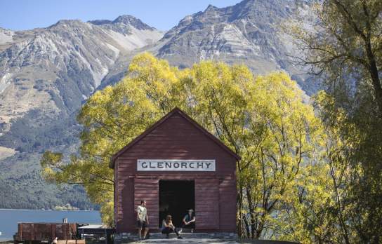Friends sitting outside the Glenorchy Red Shed