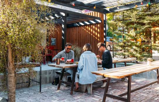 Group of people dining in an outdoor courtyard