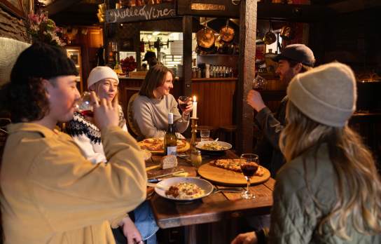 Friends eating at The Cow Restaurant Queenstown