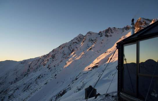Early mountain at Mountainhut Accommodation, surrounded by snow-covered mountains