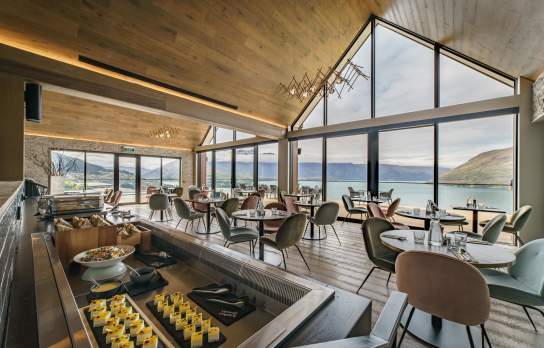 Event or conference set up in a hotel with view of lake and mountains out the windows