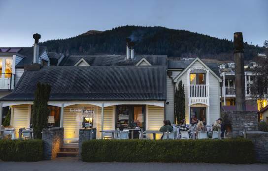 Outside shot of Botswana Butchery Restaurant historic building at dusk